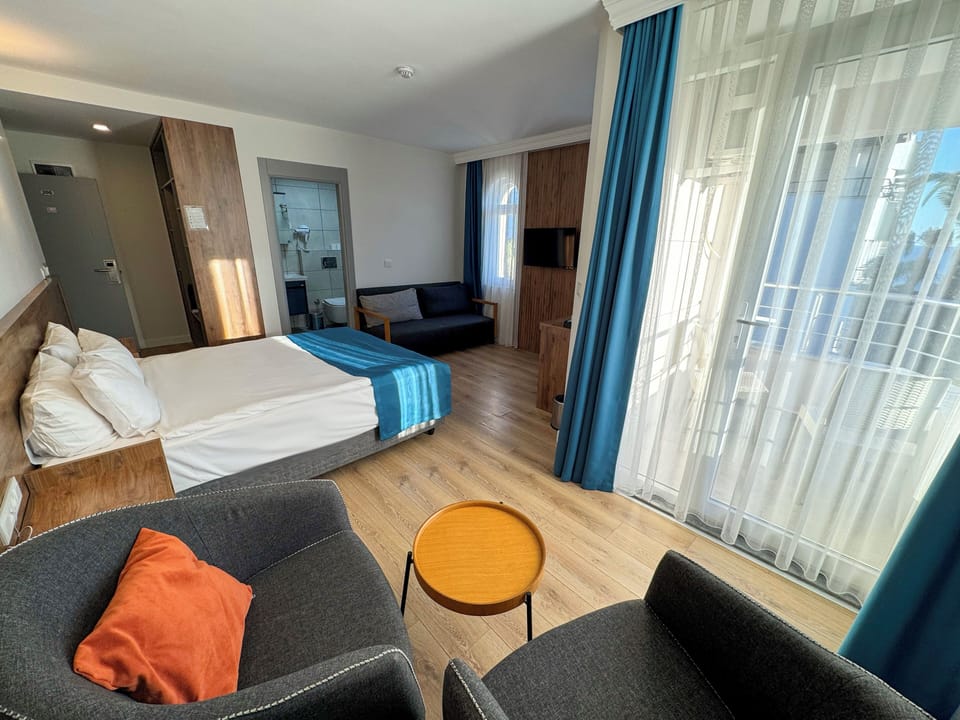 Superior Room, Balcony, Sea View | Minibar, desk, free cribs/infant beds, free WiFi