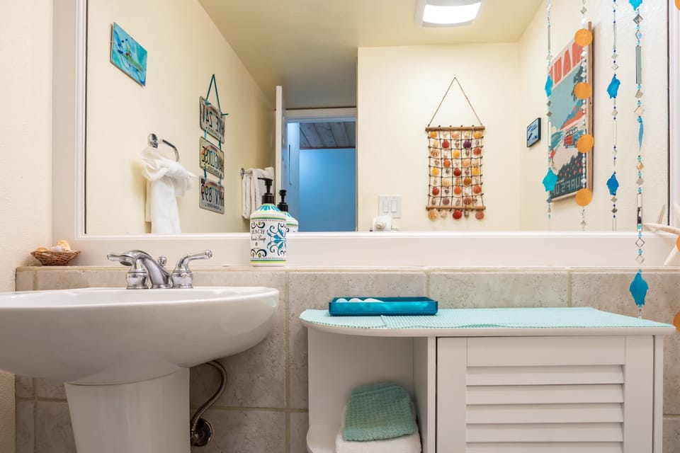 Guest bathroom features beachy decor!