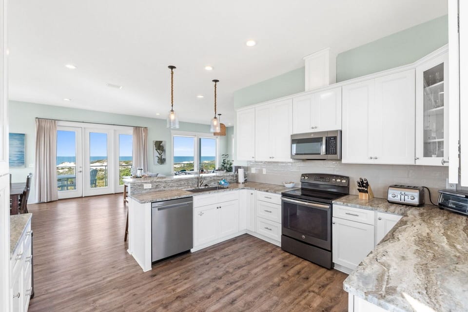 Kitchen overlooking the living room - Kitchen has a Keurig and standard coffee pot along with all other necessary kitchen amenities!