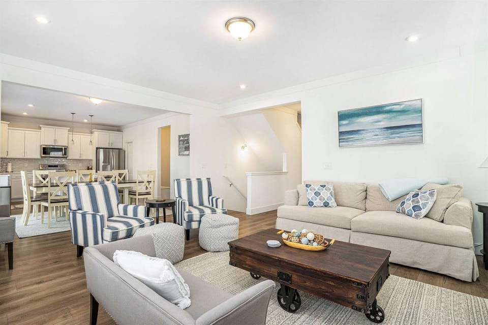 Open living space with comfy seating and a full kitchen.