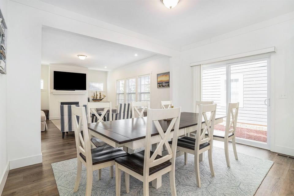 Dining area with seating for eight and easy access to the living room and patio.
