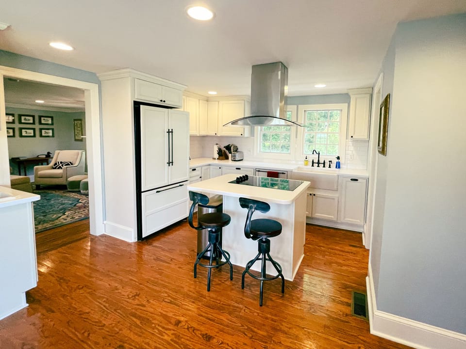Fridge with filtered water, dishwasher, farmhouse sink, microwave, wet bar.