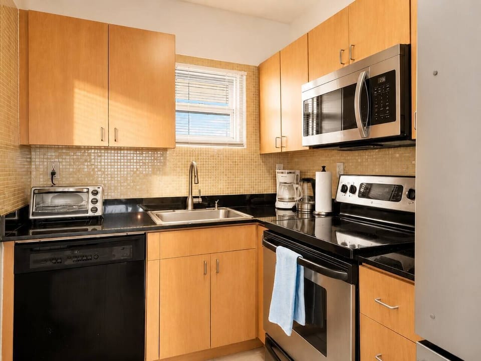 Everything you need for a full breakfast is right here, coffee maker, toaster oven, and stove all set up. Load the dishwasher after so you're not stuck scrubbing pans on vacation.