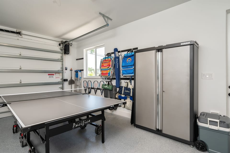 Beach chairs, racquets, games, and cooler for use