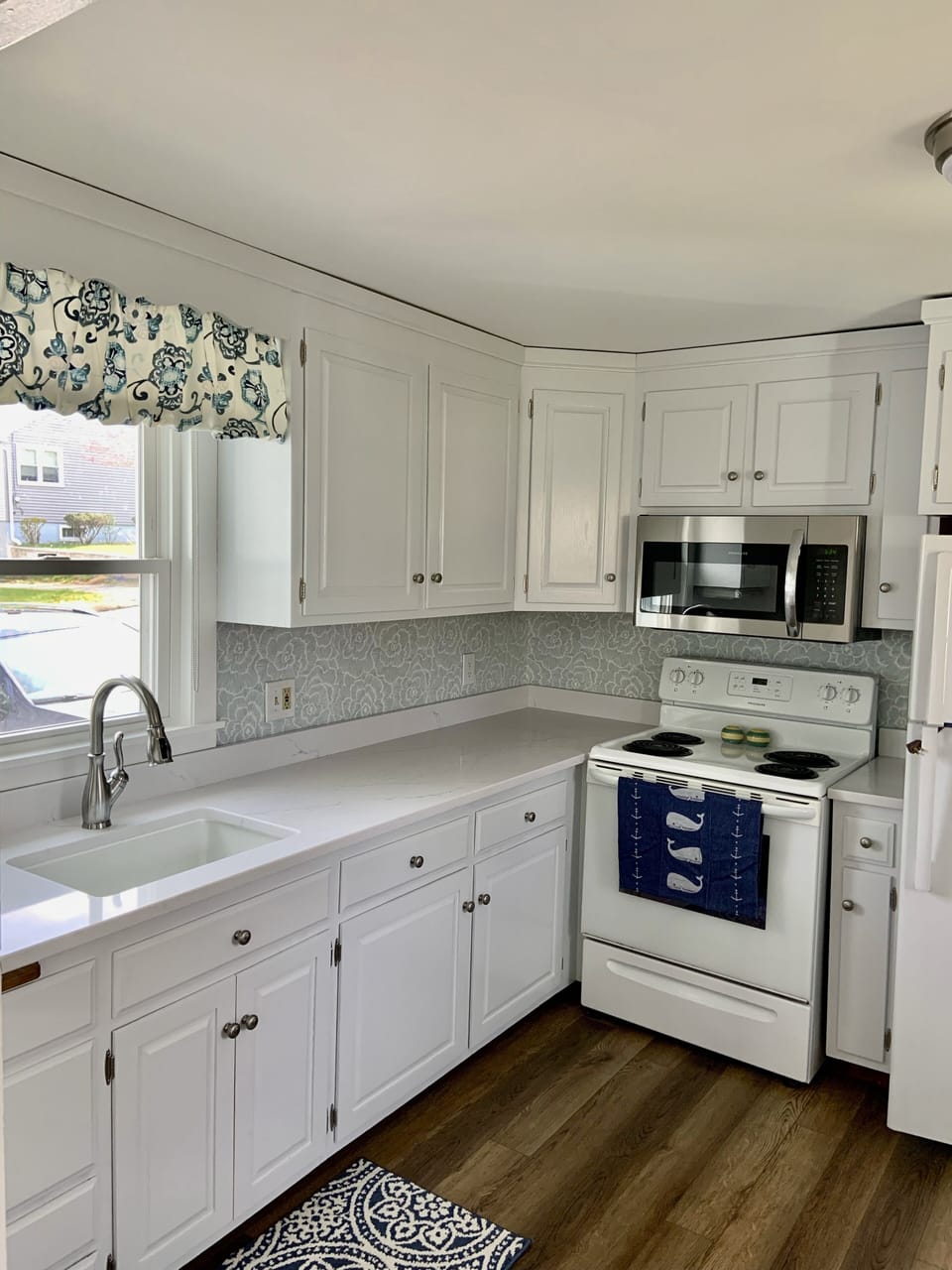 Newly renovated kitchen with quartz countertops 