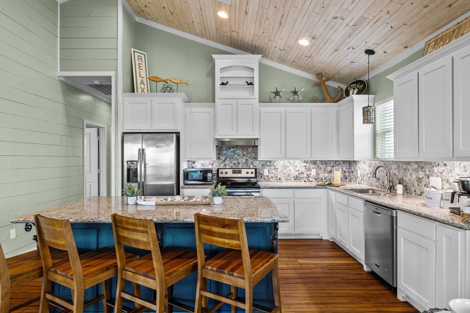 Open concept kitchen with all the appliances. Dishwasher and Refrigerator w/ice and water dispenser