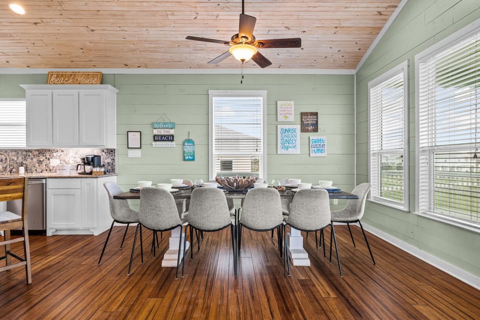 Custom dining table surrounded by beautiful farmhouse beachy feel.