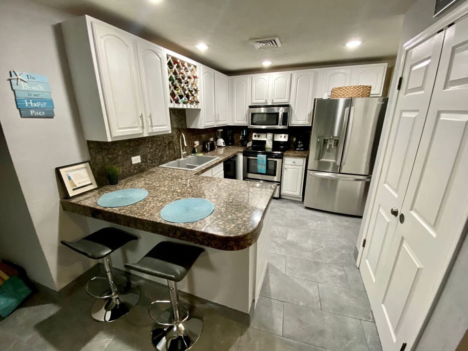 Full kitchen with upgraded stain steel appliance package. New sink and faucet