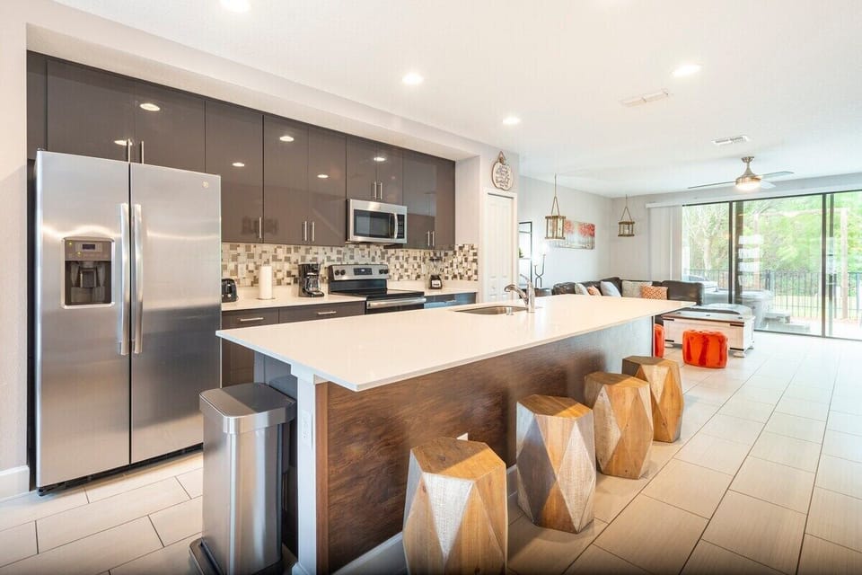 Fall in love for modern open kitchen—a beautiful, vibrant space that seamlessly combines style and functionality. a family-friendly retreat where the joy of cooking meets the warmth of togetherness.