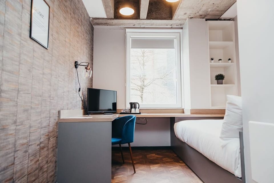 Economy Room | Blackout drapes, iron/ironing board, free WiFi, bed sheets
