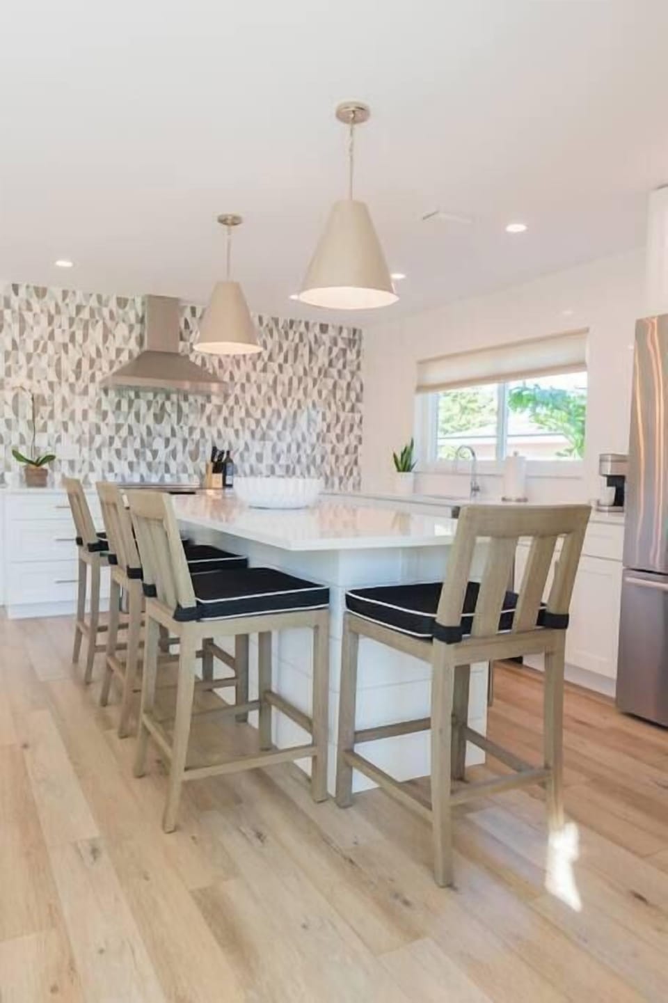 Breakfast Bar seating is great so you never miss the conversation while cooking in the kitchen!