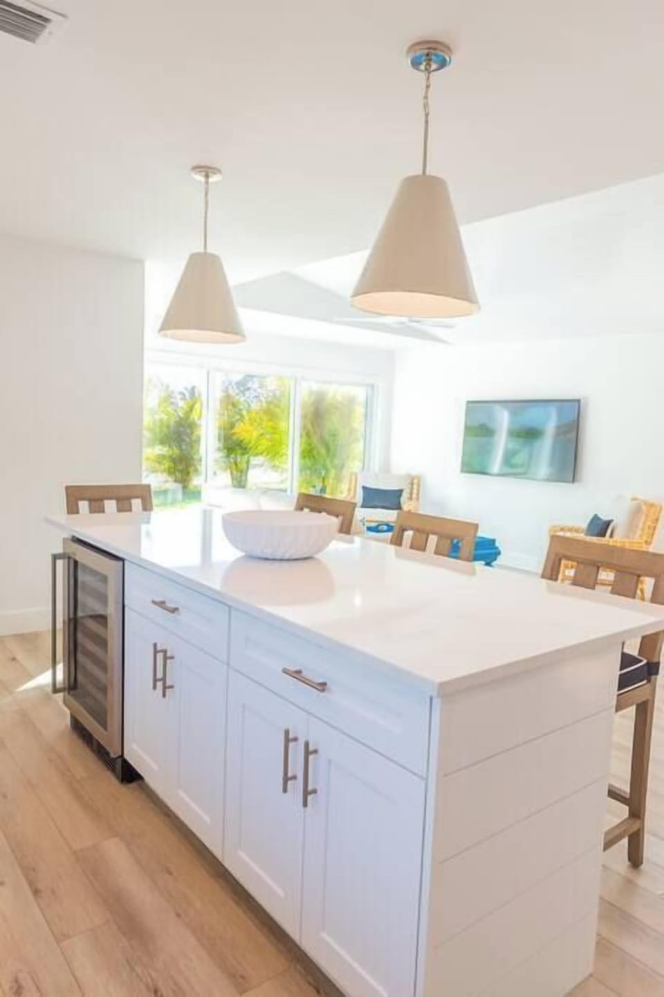 Large renovated kitchen has adjacent 6-top dining area and bar seating for 4
