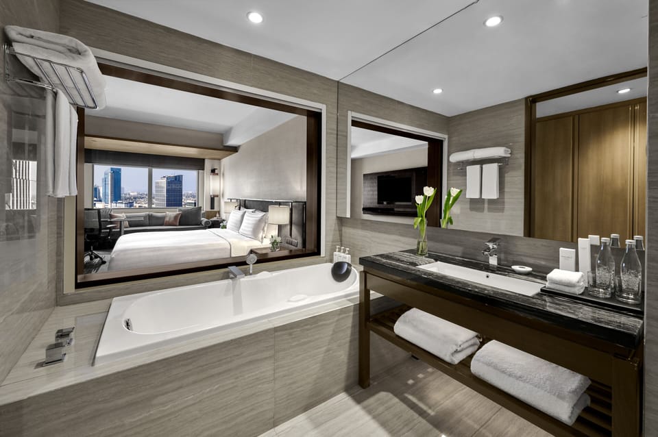 Separate tub and shower, designer toiletries, hair dryer, bathrobes