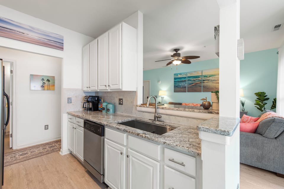 Fully remodeled kitchen overlooks living room.