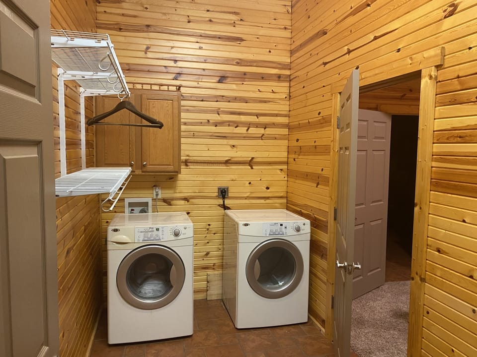 Entry to Bedroom 2 through second laundry with area to hang clothes 