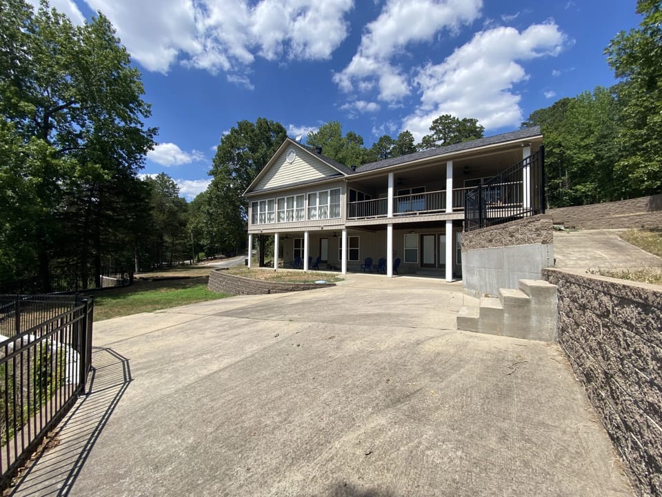 Back of house with plenty of places to view the lake