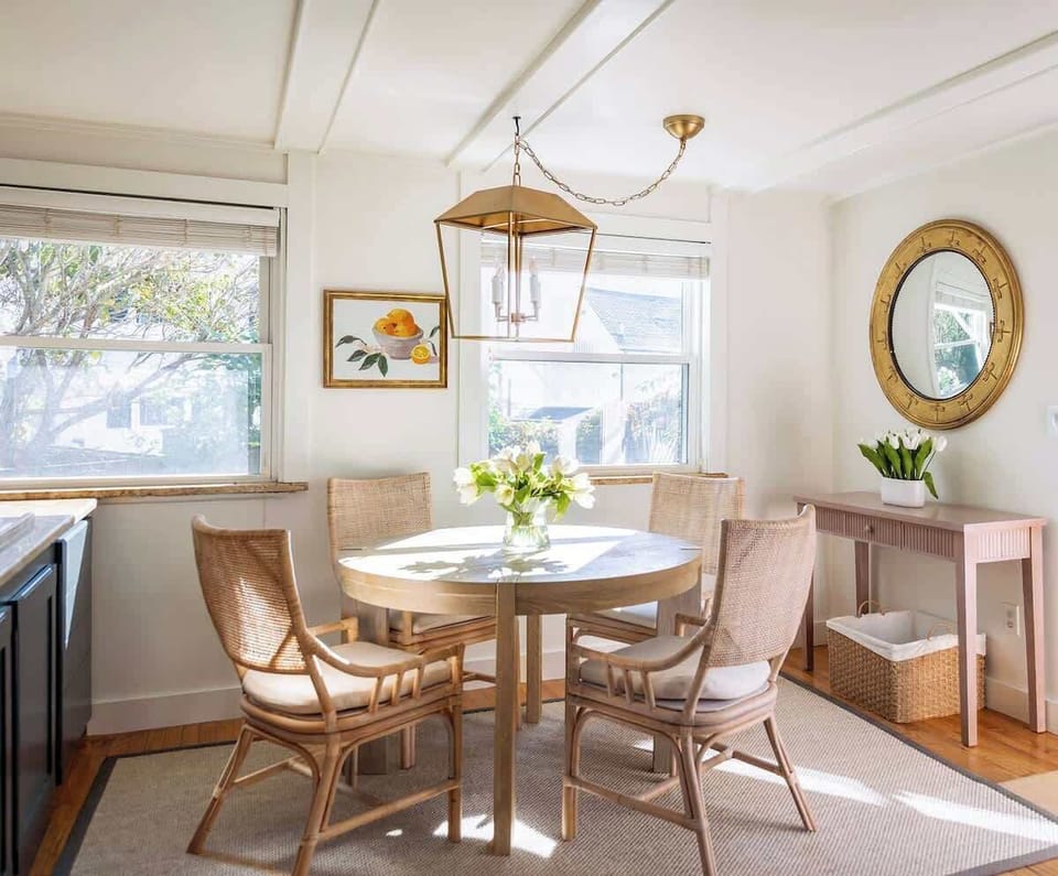 Elegant dining space adjacent to the kitchen, comfortably seating four. Additional bar seating in the kitchen accommodates three more guests.