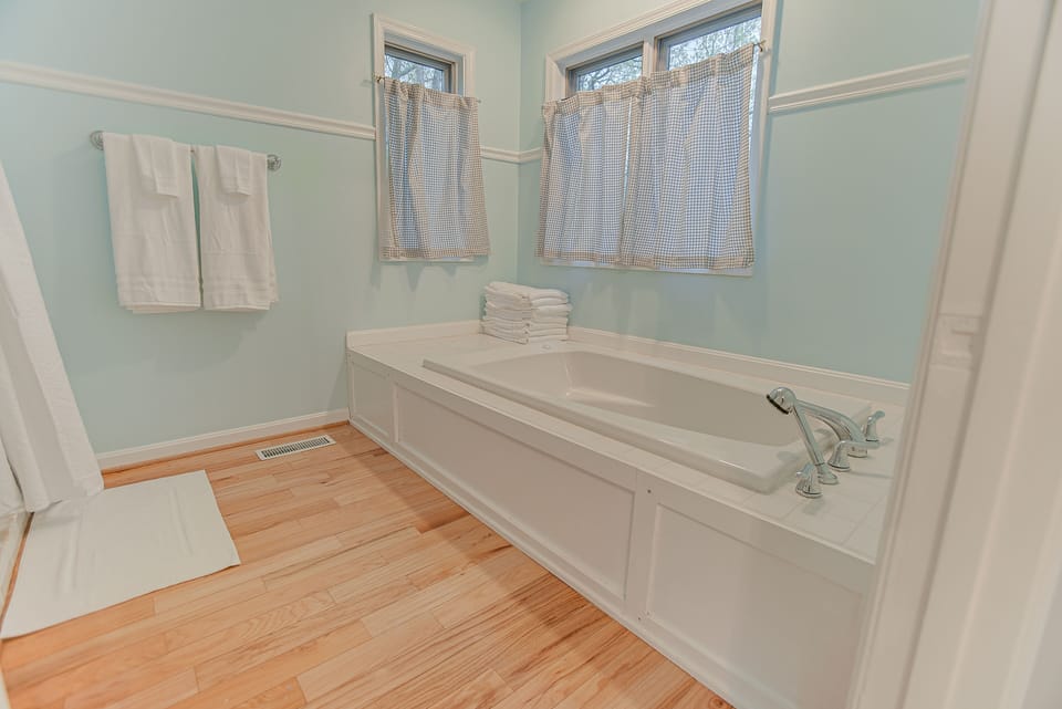 Full Bath 1 located on the main level with jacuzzi tub and shower.
