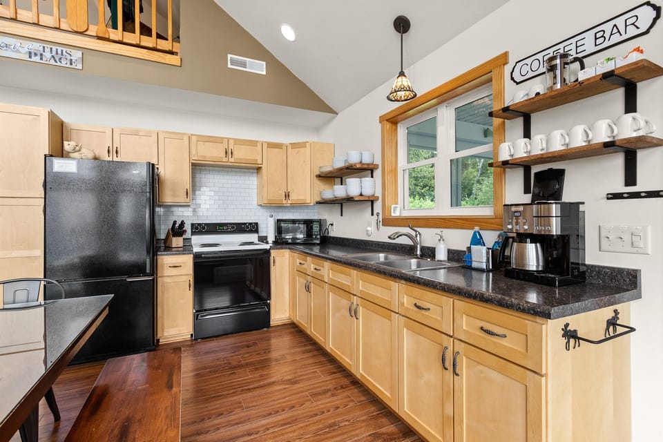 The Coffee Bar is stocked and the Cuisinart is ready. First one up sets the pot — Door County mornings start here before anyone heads to the dock, the hammock, or the fire pit.