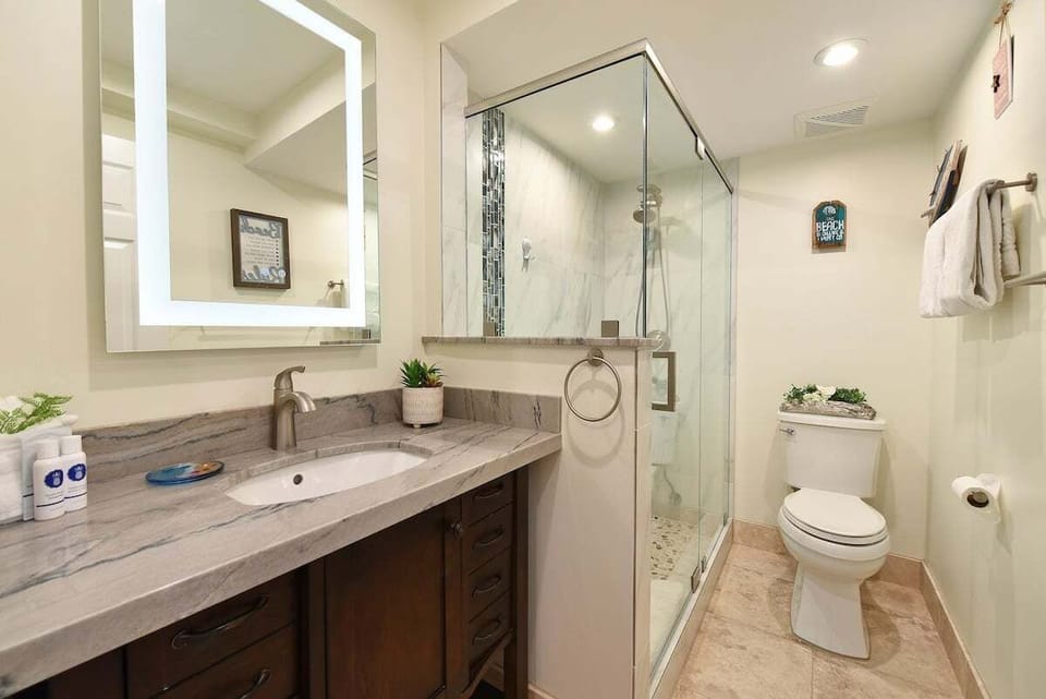 Clean lines and modern lighting make this stylish bathroom the perfect place to refresh and recharge.