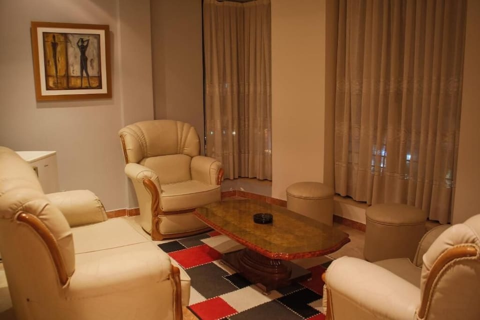 Double Room | Living area | 10-cm flat-screen TV with satellite channels, TV