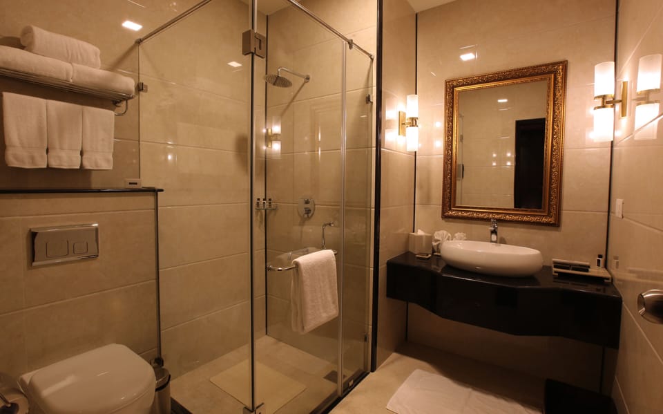 Shower, rainfall showerhead, designer toiletries, hair dryer