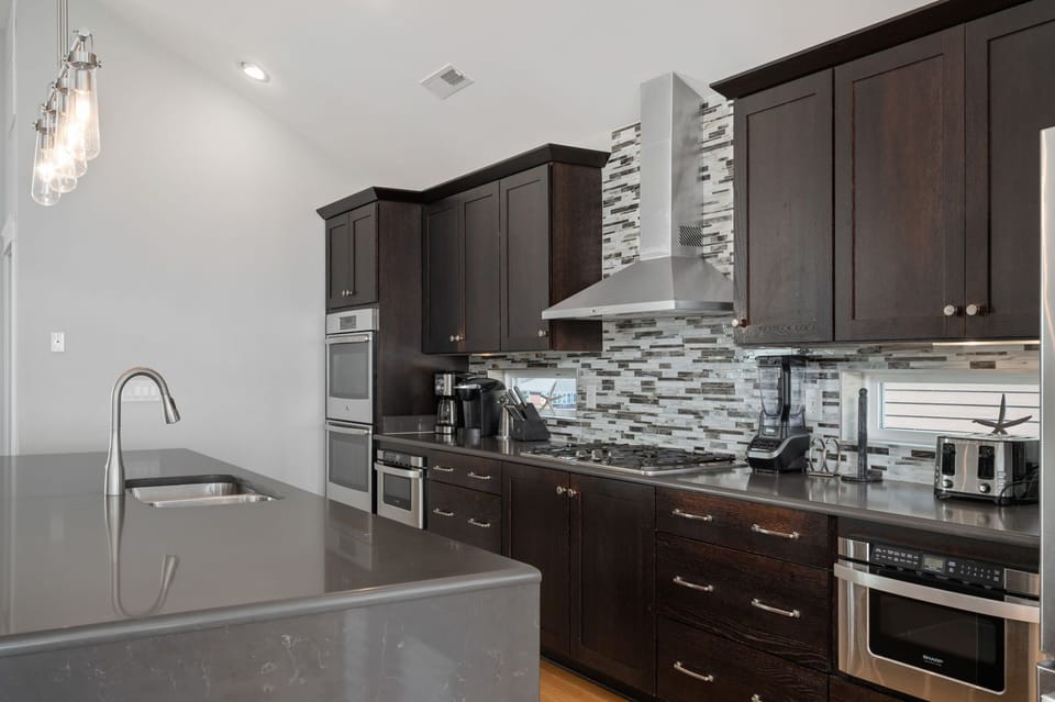 Kitchen Area with Bar Seating on Third Level