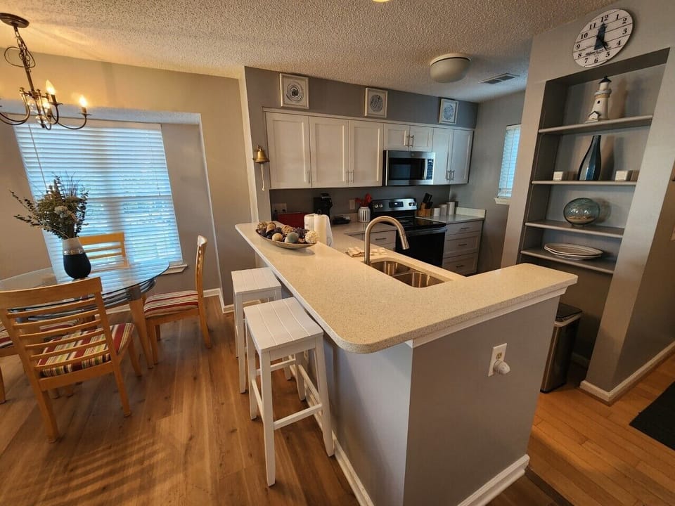 Kitchen with Bar Stool Seating and Dining Area