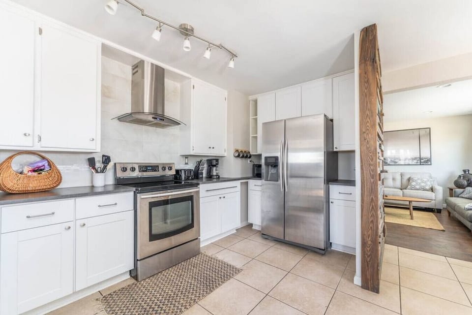 Full kitchen with stainless appliances for cooking at home