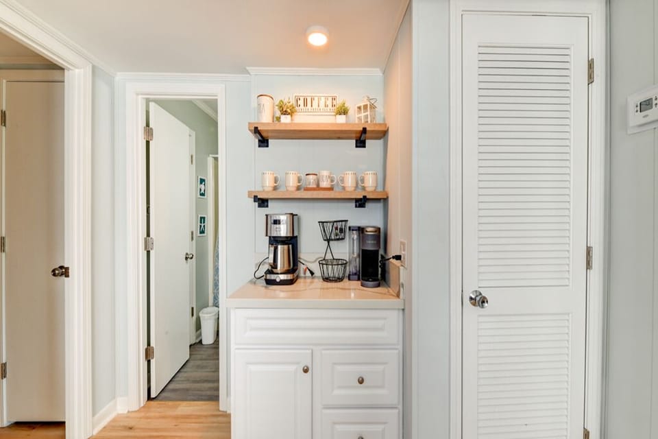 Coffee bar with Keurig and a drip coffee maker. Enjoy a cup on private balcony.