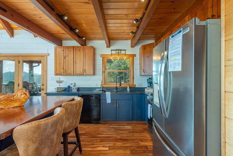 Well-equipped kitchen complete with a dishwasher, a range with an air fryer option & a coffee bar with a grinder, and 2 types of coffeemakers (drip-style & Keurig).