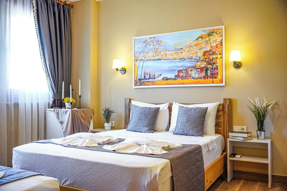 Deluxe Quadruple Room | Premium bedding, free WiFi, bed sheets