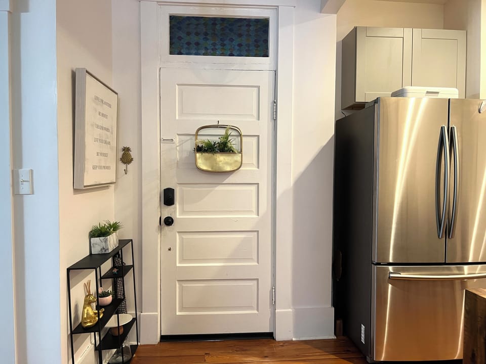 Just inside the apartment entrance.