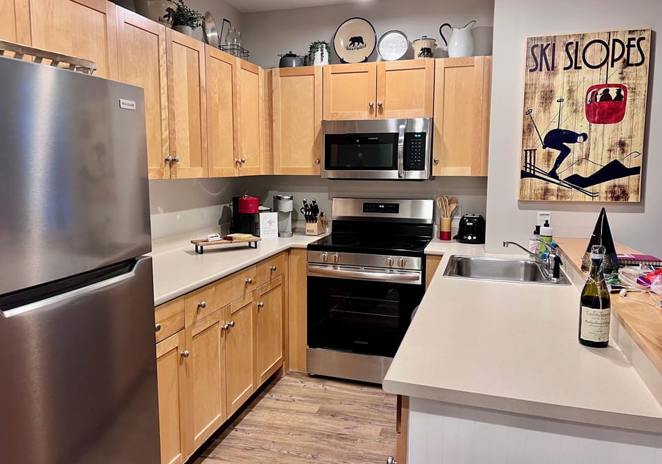 Functional kitchen supplied with everything you need! Open to living space.