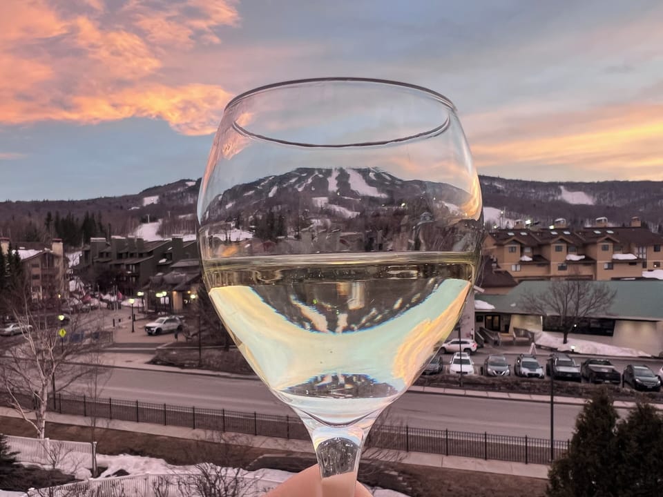 Wine on balcony at sunset