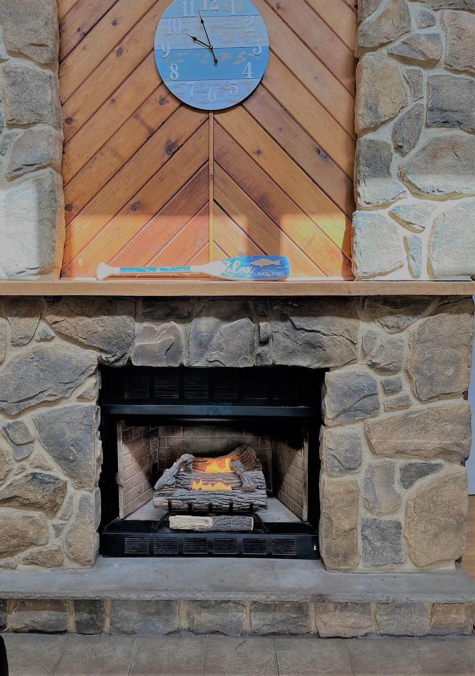 The stone fireplace in the main house is the perfect place to gather
