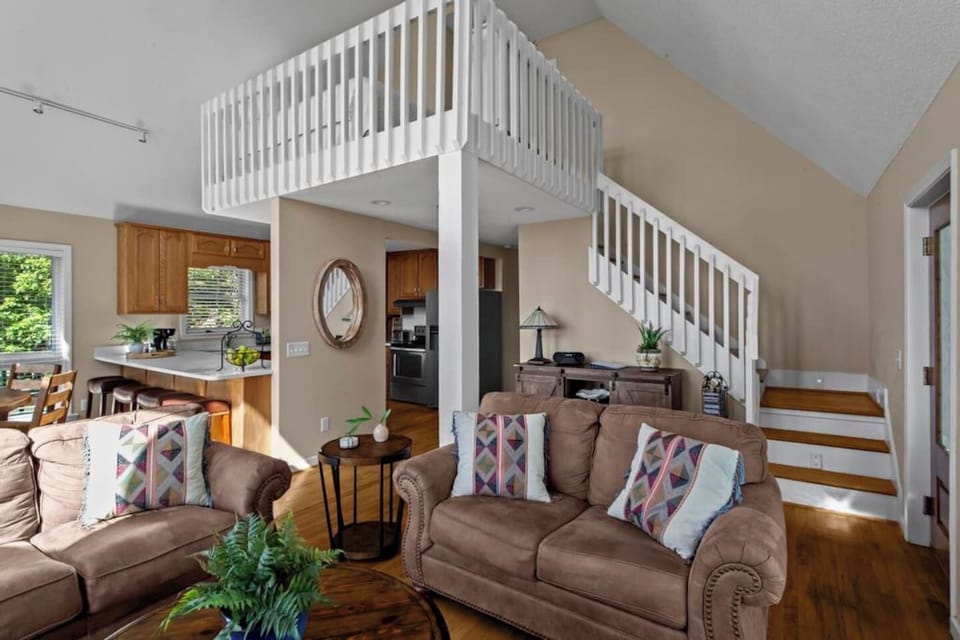 Spacious open-plan living area with comfy seating.