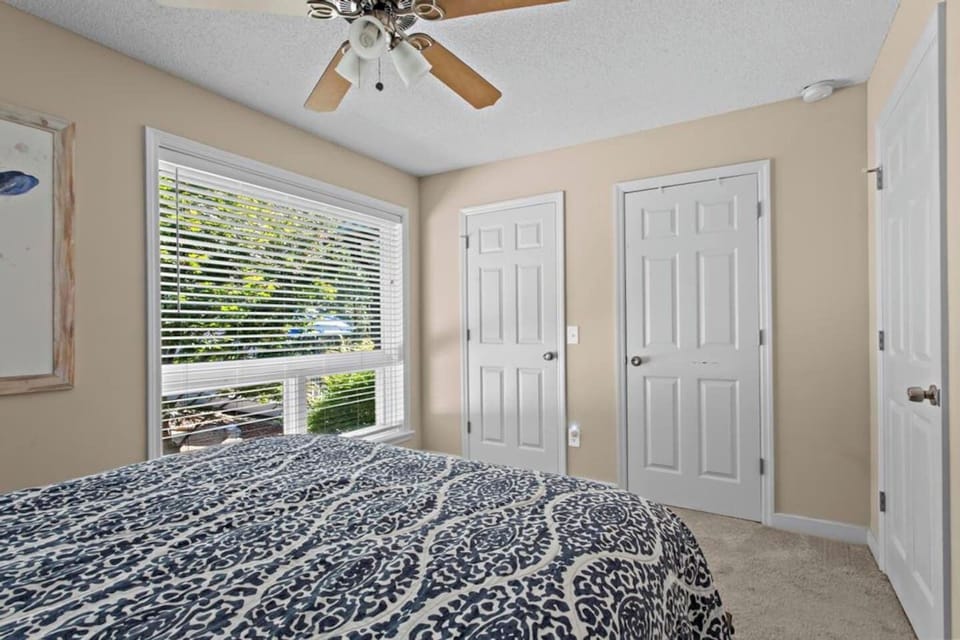 Drift into tranquility in this cozy retreat, where a plush queen bed, generous closet space, and calming natural surroundings create the perfect space to recharge.