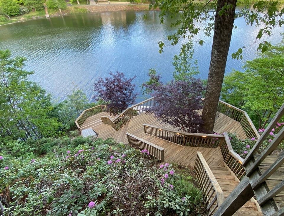 Enjoy beautiful view and  cool breezes from the lake on a large multi-level deck