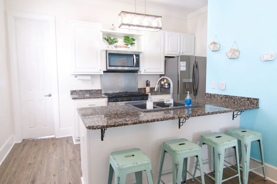 Large kitchen with gas stove, dishwasher, pantry & fridge — all the essentials