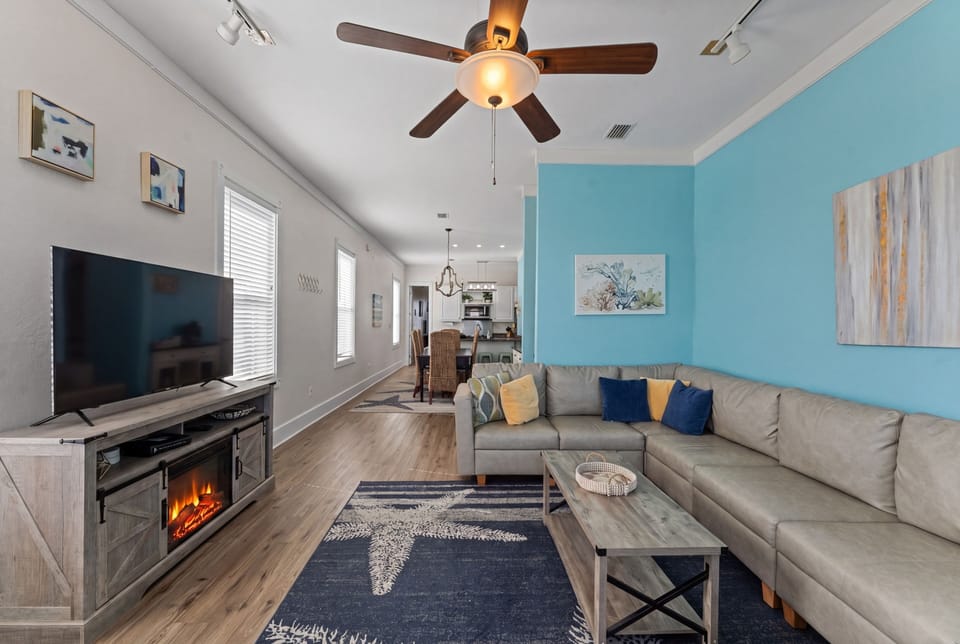 Bright living room with cozy electric fireplace, new furniture & smart TV