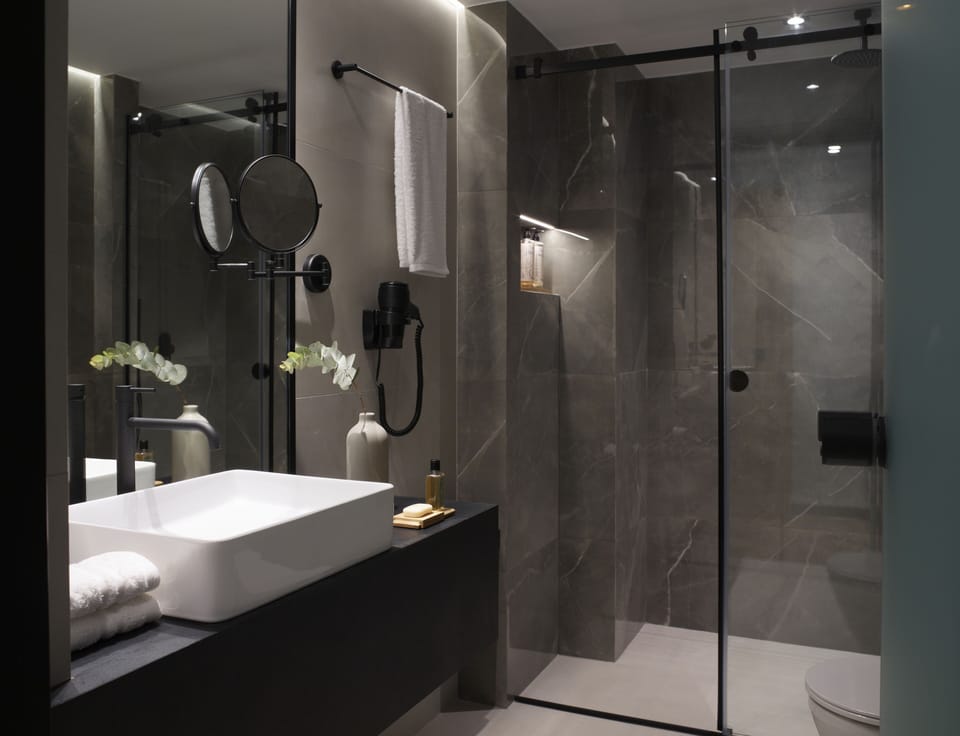 Rainfall showerhead, designer toiletries, hair dryer, slippers