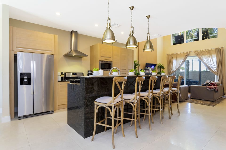 Family Townhome, 4 Bedrooms | Private kitchen | Full-size fridge, microwave, oven, stovetop