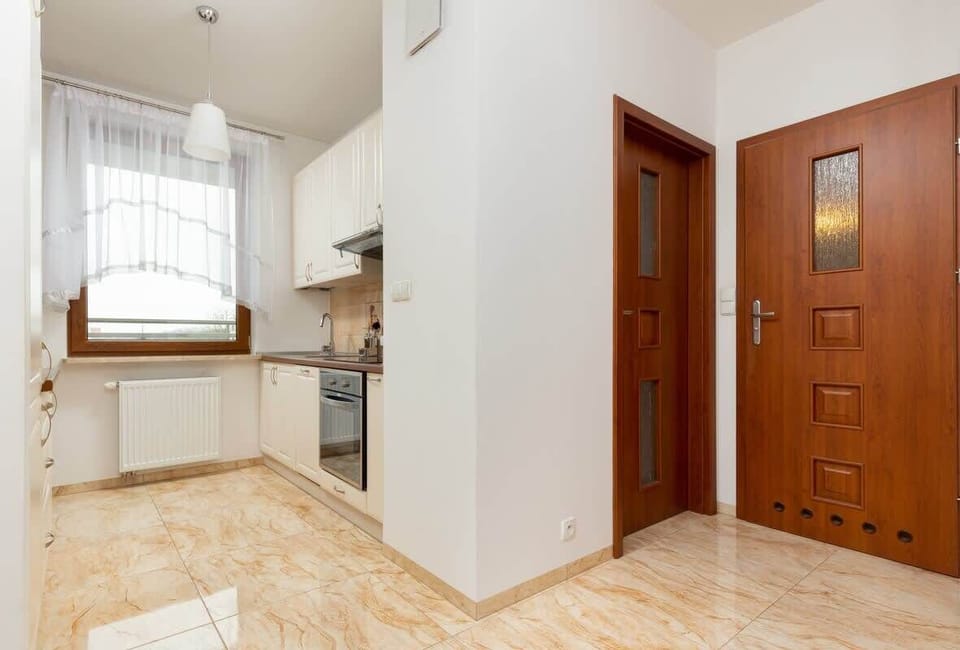 The sleek design of the kitchenette blending seamlessly with the living area.