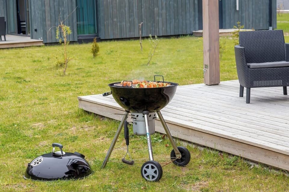 Terrace with garden furniture and barbecue.