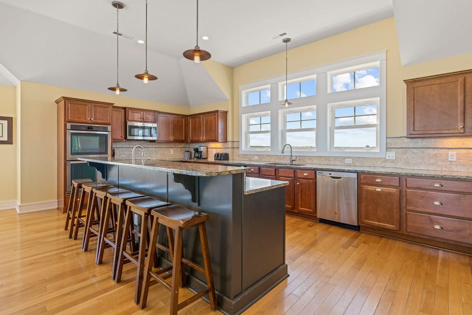 Expansive Kitchen with Bar Seating on Third Level