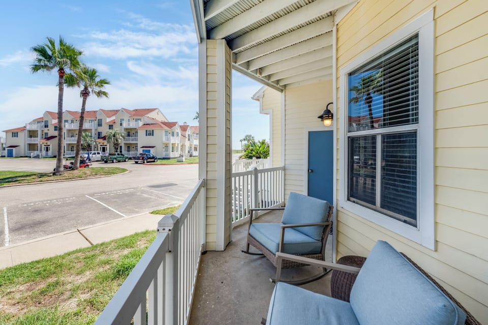 Relax on your private balcony with comfortable seating and tropical palm views. The perfect spot to unwind after exploring.