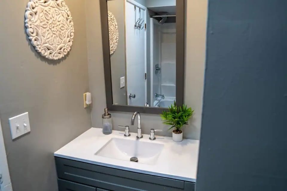 Efficient Hall Bathroom offers tub/shower and new bathroom vanities.
