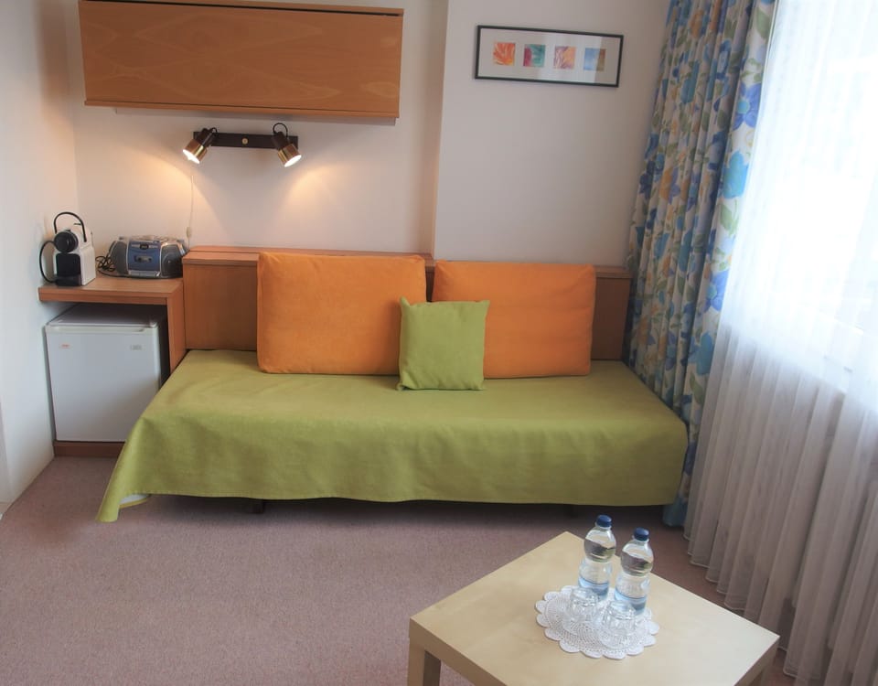 Economy Double Room, 1 Bedroom | Living area | Flat-screen TV, toys