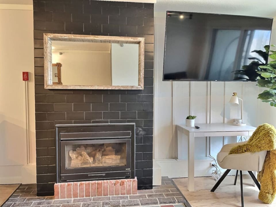 Cozy gas fireplace and huge TV with super fast internet. Note: The fireplace is not operational due to an issue with the chimney.